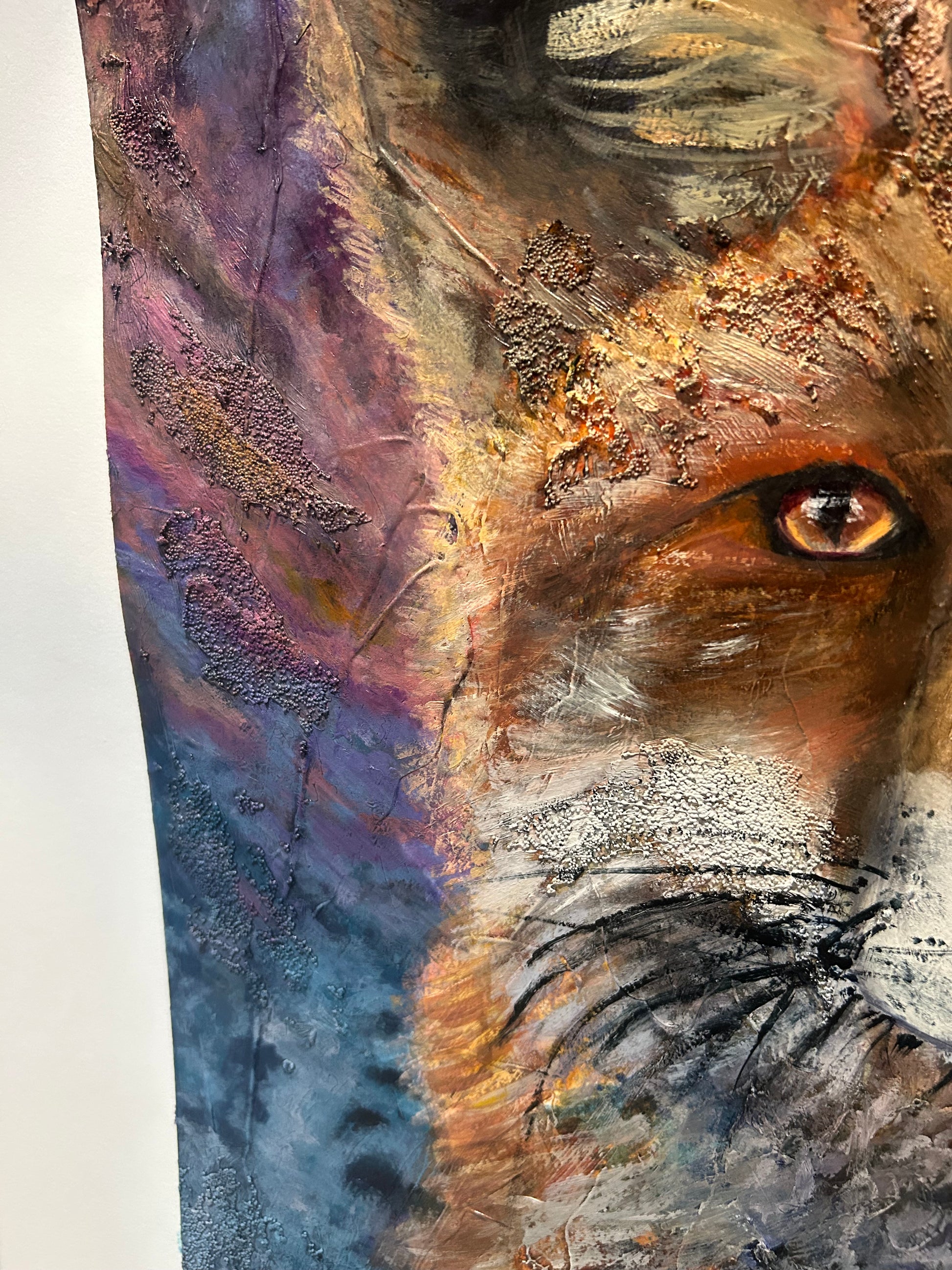 Close-up of a textured surface with a focus on a detailed eye