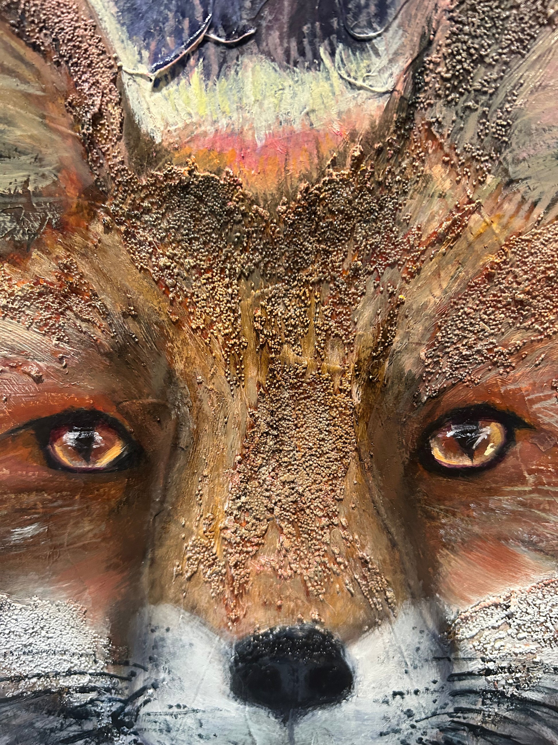Close up details of a fox painting, showing the eyes and textures of the fur