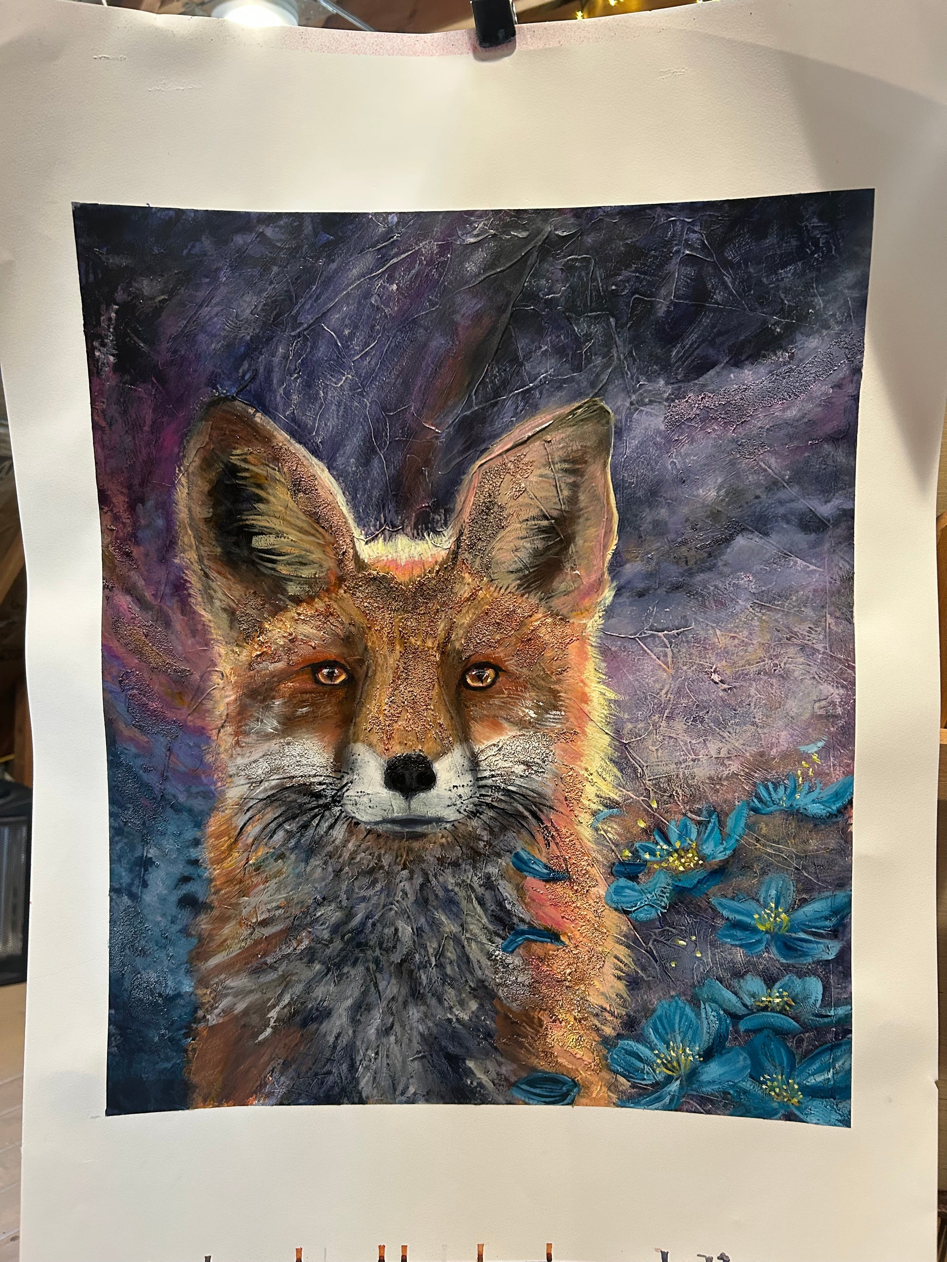 Colorful painting of a fox with floral elements on a dark space like background